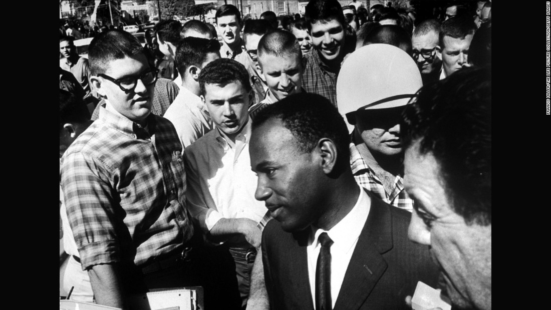 James Meredith is accompanied by two federal marshals and surrounded by jeering students after registering for entry at the &lt;strong&gt;University of Mississipp&lt;/strong&gt;i in the fall of 1962. The first African-American student to enroll at the school, Meredith suffered constant harassment on campus before graduating the next year.