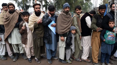 Afghan refugees wait to update their family data at the UNHCR Verification Center in Chamkani, on the outskirts of Peshawar on January 26, 2017. 
More than 380,000 registered Afghan refugees returned from Pakistan in 2016. / AFP / ABDUL MAJEED        (Photo credit should read ABDUL MAJEED/AFP/Getty Images)