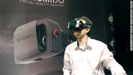 PARIS, FRANCE - OCTOBER 27:  A gamer plays a game with the virtual reality head-mounted display 'Homido' during the 'Paris Games week' at Parc des Expositions Porte de Versailles on October 27, 2015 in Paris, France. The display transfers the eye movements to the game in real time. 'Paris Games week' takes place from October 28, 2015 until November 01, 2015.  (Photo by Chesnot/Getty Images)