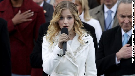 WASHINGTON, DC - JANUARY 20: Former president Barack Obama places his hand on his heart as Jackie Evancho sings the national anthem on the West Front of the U.S. Capitol on January 20, 2017 in Washington, DC. In today&#39;s inauguration ceremony Donald J. Trump becomes the 45th president of the United States.  (Photo by Alex Wong/Getty Images)