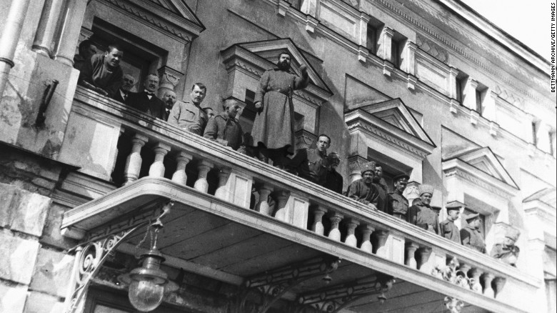 Russian revolutionists stand on the balcony of the Tsar&#39;s residence near Petrograd.