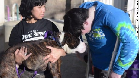 Boy who lost leg to cancer adopts three-legged dog.