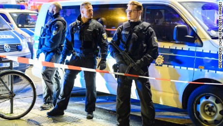 DUSSELDORF, GERMANY - MARCH 09: Police and emergency workers stand outside the main railway station following what police described as an axe attack on March 9, 2017 in Dusseldorf, Germany. According to initial reports a man wielding an axe entered the station and injured two people. (Photo by Alexander Scheuber/Getty Images)