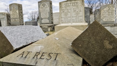 A tombstone is broken in two after the vandalism in the cemetery of Mount Carmel.