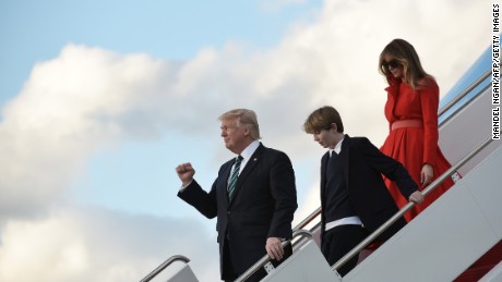 TOPSHOT - US President Donald Trump, son Barron and wife Melania step off Air Force One upon arrival at Palm Beach International Airport in West Palm Beach, Florida on March 17, 2017.
Trump is heading to Palm Beach, Florida where he is scheduled to spend the weekend at the Mar-a-Lago estate. / AFP PHOTO / MANDEL NGAN        (Photo credit should read MANDEL NGAN/AFP/Getty Images)