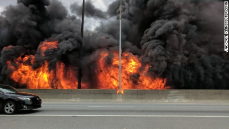 Flames from a massive fire that eventaully led a portion of the highway to collapse, are seen along Interstate 85 in Atlanta on Thursday, March 30. 