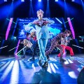 Kim Ki Bum, known as &quot;Key,&quot; sings in the front of the rest of the SHINee band in Dallas.