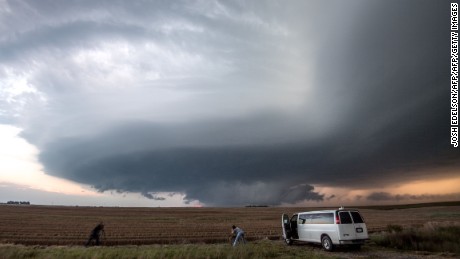 Storm chasing photographers take photos underneath a rotating supercell storm system in Maxwell, Nebraska on September 3, 2016. Although multiple tornado warnings were issued throughout the area, no funnel cloud touched down. / AFP / Josh Edelson / XGTY
RESTRICTED TO EDITORIAL USE  / MANDATORY CREDIT:  &quot;AFP PHOTO / Josh EDELSON&quot; / NO MARKETING / NO ADVERTISING CAMPAIGNS /  DISTRIBUTED AS A SERVICE TO CLIENTS  ==        (Photo credit should read JOSH EDELSON/AFP/Getty Images)