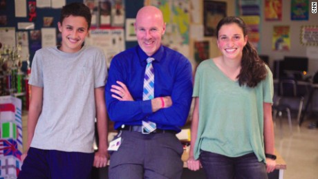 Teacher Brian O&#39;Conner with two former students who were inspired by CNN Heroes.