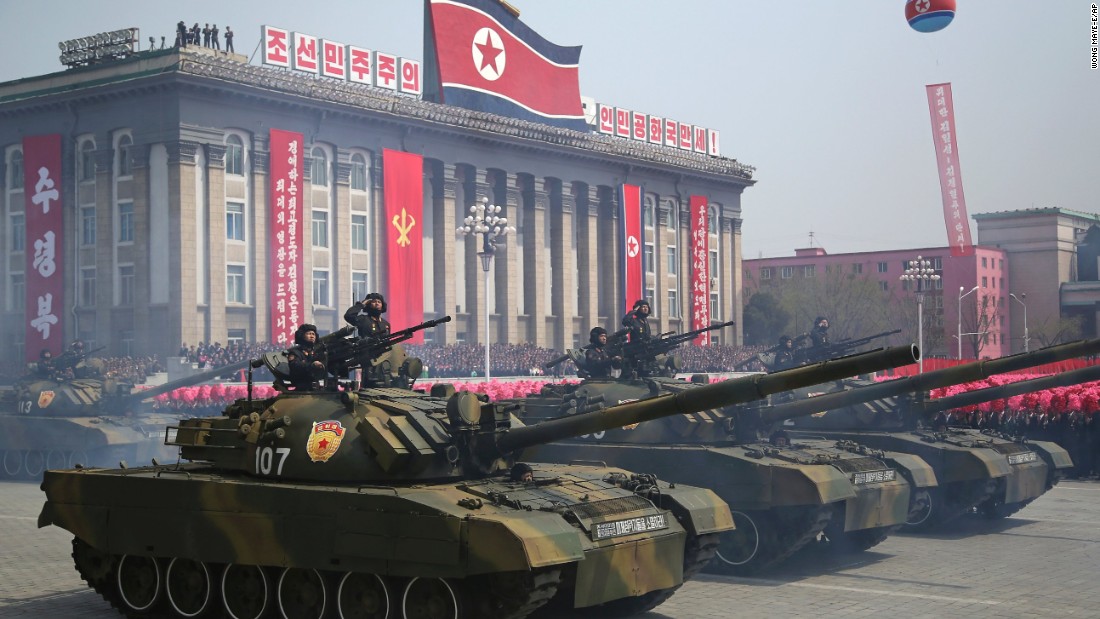 Soldiers in tanks take part in the military parade.