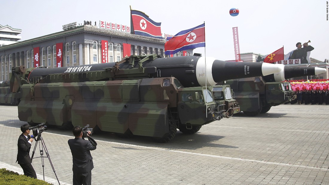 Missiles are paraded across Kim Il Sung Square.