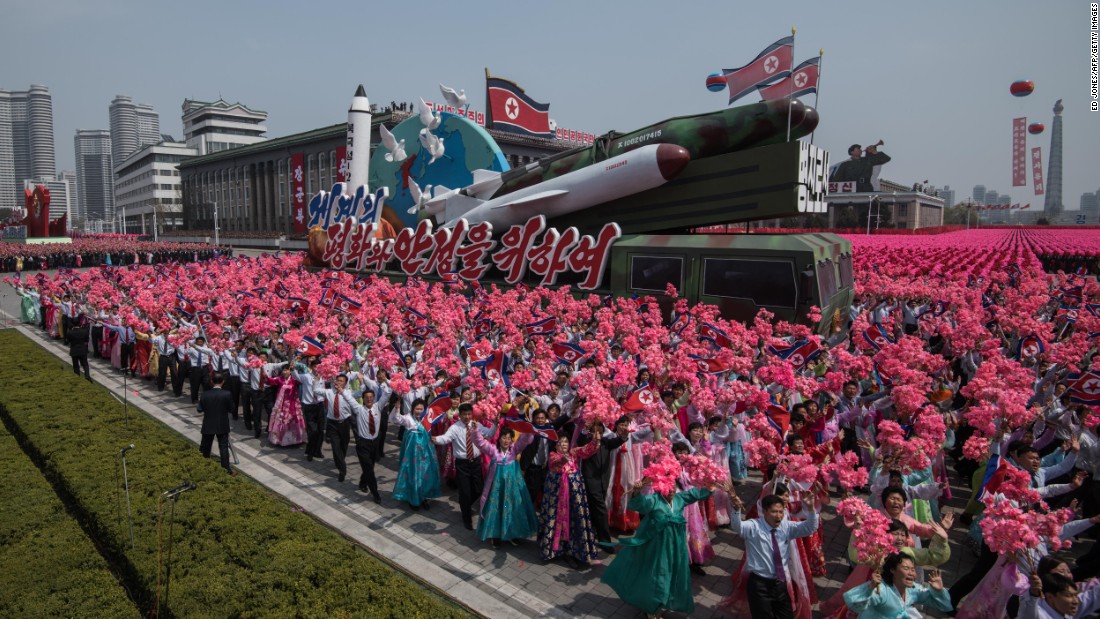 A rocket-themed float makes its way through Kim Il-Sung square.