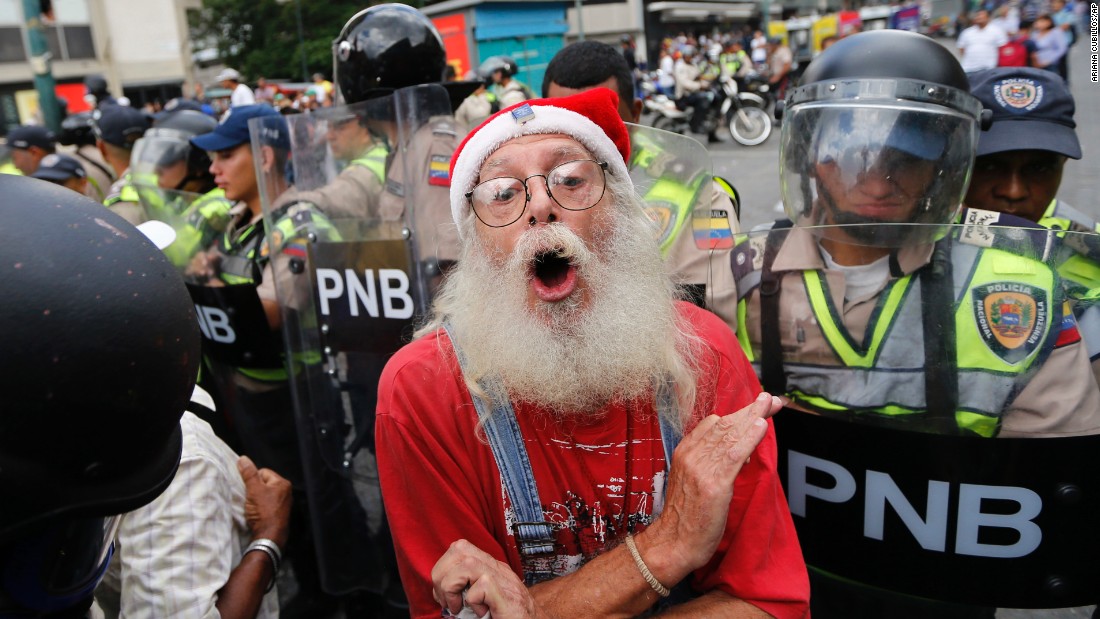 During a &lt;a href=&quot;http://www.cnn.com/2017/05/12/americas/venezuela-grandparents-march/&quot; target=&quot;_blank&quot;&gt;&quot;Grandparents&#39; March&quot;&lt;/a&gt; in Caracas, a man is blocked by police from reaching the Government Ombudsman&#39;s Office on Friday, May 12.
