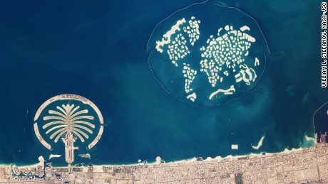 This astronaut photograph captures the Palm Jumeirah and the islands of the world. 
