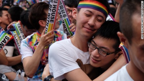 Same-sex activists hug outside the parliament in Taipei on May 24, 2017 as they celebrate the landmark decision paving the way for the island to become the first place in Asia to legalise gay marriage.
Crowds of pro-gay marriage supporters in Taiwan on May 24 cheered, hugged and wept as a top court ruled in favour of same-sex unions. / AFP PHOTO / SAM YEH        (Photo credit should read SAM YEH/AFP/Getty Images)