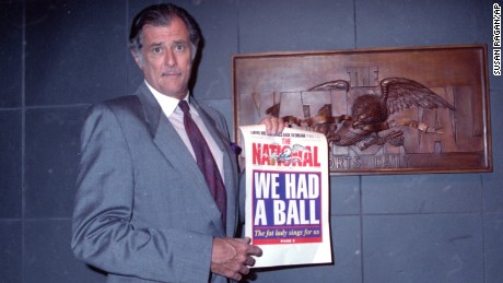 Frank Deford, editor and publisher of The National Sports Daily, holds a proof of the final front page of the newspaper after a news conference at the paper&#39;s offices in New York City on Wednesday, June 12, 1991.  He announced that the publication would fold with Thursday&#39;s issue. 