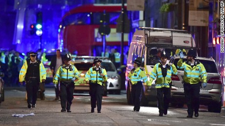 Police officers on Borough High Street as police are dealing with an incident on London Bridge in London, Saturday, June 3, 2017.    Witnesses reported a vehicle hitting pedestrians and injured people on the ground. (Dominic Lipinski/PA via AP)