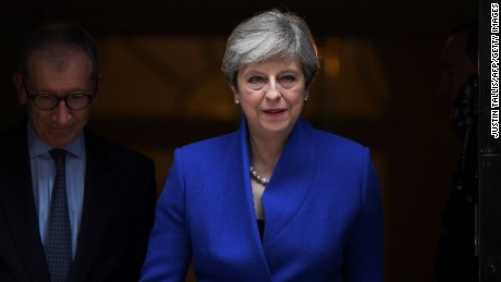 Britain's Prime Minister and leader of the Conservative Party Theresa May leaves 10 Downing Street in central London on June 9, 2017, en route to Buckingham Palace to meet Queen Elizabeth II, the day after a general election in which the Conservatives lost their majority.
British Prime Minister Theresa May will on Friday seek to form a new government, resisting pressure to resign after losing her parliamentary majority ahead of crucial Brexit talks. May is set to meet the head of state Queen Elizabeth II and ask for permission to form a new government, according to her Downing Street office. / AFP PHOTO / Justin TALLIS        (Photo credit should read JUSTIN TALLIS/AFP/Getty Images)