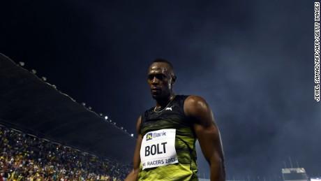 Usain Bolt (C) of Jamaica leaves the track after winning his final race in home country during the Racers Grand Prix at the national stadium in Kingston, Jamaica, on June 10, 2017.
Bolt partied with his devoted fans in an emotional farewell at the National Stadium on June 10 as he ran his final race on Jamaican soil.
Bolt is retiring in August following the London World Championships. / AFP PHOTO / Jewel SAMAD        (Photo credit should read JEWEL SAMAD/AFP/Getty Images)