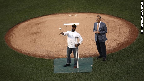 WASHINGTON, DC - JUNE 15:  U.S. Capitol Hill special agent David Bailey (L), who was wounded in yesterday&#39;s shooting, throws out the first pitch before the Congressional Baseball Game at Nationals Park on June 15, 2017 in Washington, DC. Bailey and special agent Crystal Griner were assigned to U.S. Rep. Steve Scalise (R-LA) and returned fire during the attack. Scalise is in critical condition following a shooting yesterday during a Republican congressional baseball team practice.  (Photo by Win McNamee/Getty Images)