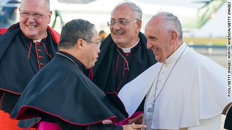 NEW YORK, NY - SEPTEMBER 24: Cardinal Timothy Dolan, the Archbishop of New York, Archbishop Bernardito Auza and Bishop Nicholas DiMarzio of Brooklyn welcome Pope Francis during his arrival at John F. Kennedy International Airport September 24, 2015 in New York City. The Pope is on his first trip to the United States, visiting Washington, DC, New York and Philadelphia. (Photo by Craig Ruttle-Pool/Getty Images)
