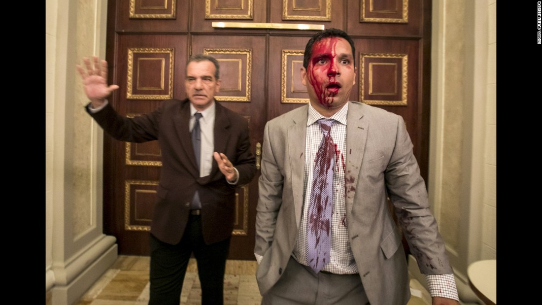 Venezuelan lawmakers Luis Stefanelli, left, and Jose Regnault appear stunned in a corridor of the National Assembly after &lt;a href=&quot;http://www.cnn.com/2017/07/05/americas/venezuela-indepedence-day-clashes/index.html&quot; target=&quot;_blank&quot;&gt;a clash with demonstrators&lt;/a&gt; in Caracas on Wednesday, July 5. Supporters of Maduro stormed the building and attacked opposition lawmakers, witnesses said. At least seven legislative employees and five lawmakers were injured, according to National Assembly President Julio Borges. Journalists said they were also assaulted.