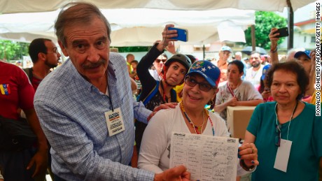 Former Mexican president Vicente Fox (L), named by the Venezuelan opposition as an observer to the opposition-organized vote to measure public support for Venezuelan President Nicolas Maduro's plan to rewrite the constitution, is pictured at a polling station in Caracas on July 16, 2017.
Authorities have refused to greenlight the vote that has been presented as an act of civil disobedience and supporters of Maduro are boycotting it. Protests against Maduro since April 1 have brought thousands to the streets demanding elections, but has also left 95 people dead, according to an official toll.  / AFP PHOTO / Ronaldo SCHEMIDT        (Photo credit should read RONALDO SCHEMIDT/AFP/Getty Images)