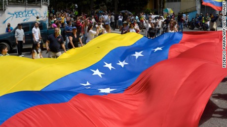 People gather in Caracas on July 16, 2017 during an opposition-organized vote to measure public support for President Nicolas Maduro's plan to rewrite the constitution.
Authorities have refused to greenlight the vote that has been presented as an act of civil disobedience and supporters of Maduro are boycotting it. Protests against Maduro since April 1 have brought thousands to the streets demanding elections, but has also left 95 people dead, according to an official toll.  / AFP PHOTO / FEDERICO PARRAFEDERICO PARRA/AFP/Getty Images