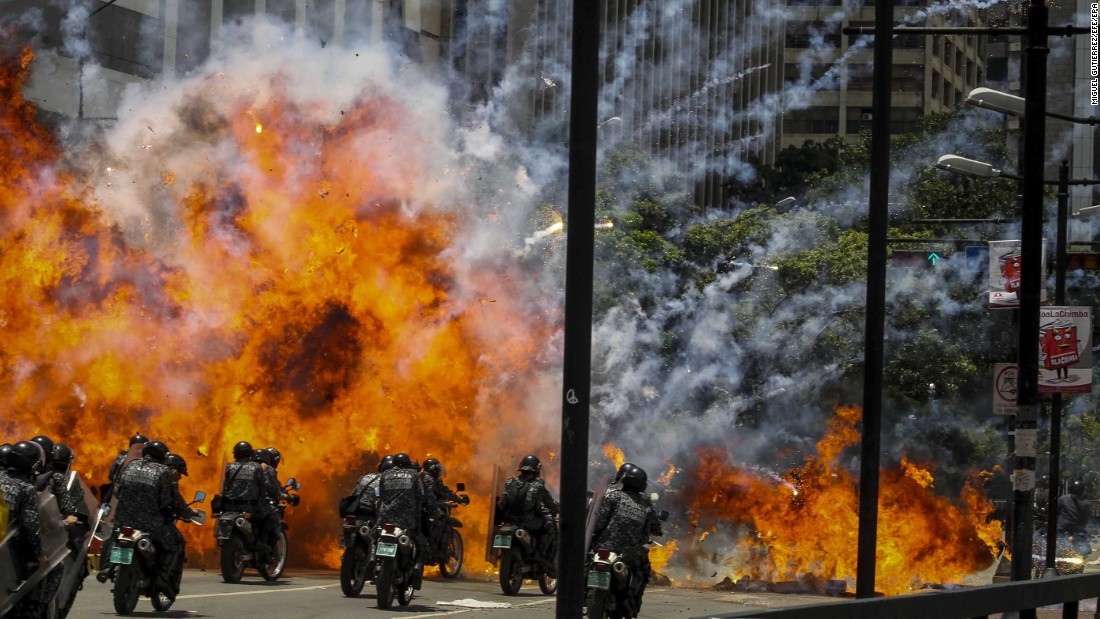 Members of Venezuela&#39;s national police are caught in an explosion as they ride motorcycles near Altamira Square in Caracas on July 30. Venezuela &lt;a href=&quot;http://www.cnn.com/2017/05/09/americas/venezuela-violin-protester/&quot; target=&quot;_blank&quot;&gt;has seen widespread unrest&lt;/a&gt; since March 29, when the Supreme Court dissolved Parliament and transferred all legislative powers to itself. The decision was later reversed, but protests have continued across the country, which is also in the midst of an economic crisis.