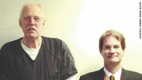 Retired US State Department counterintelligence officer Robert David Booth, right, stands beside convicted American spy Kendall Myers in 2009. Myers, a former State Department officer, was convicted and sentenced to life in prison for giving US secrets to Cuba. &quot;This a very rare photo,&quot; Booth said. Myers was being debriefed at the FBI field office in Washington about his crimes a few months after his arrest. FBI agents don&#39;t take photos during espionage debriefings, Booth said. Booth said he would often bring Myers hot pastrami sandwiches and carrot cake to entice him to reveal more information during their questionging sessions. &quot;I probably got about 70%&quot; of what I wanted,&quot; Booth said. 