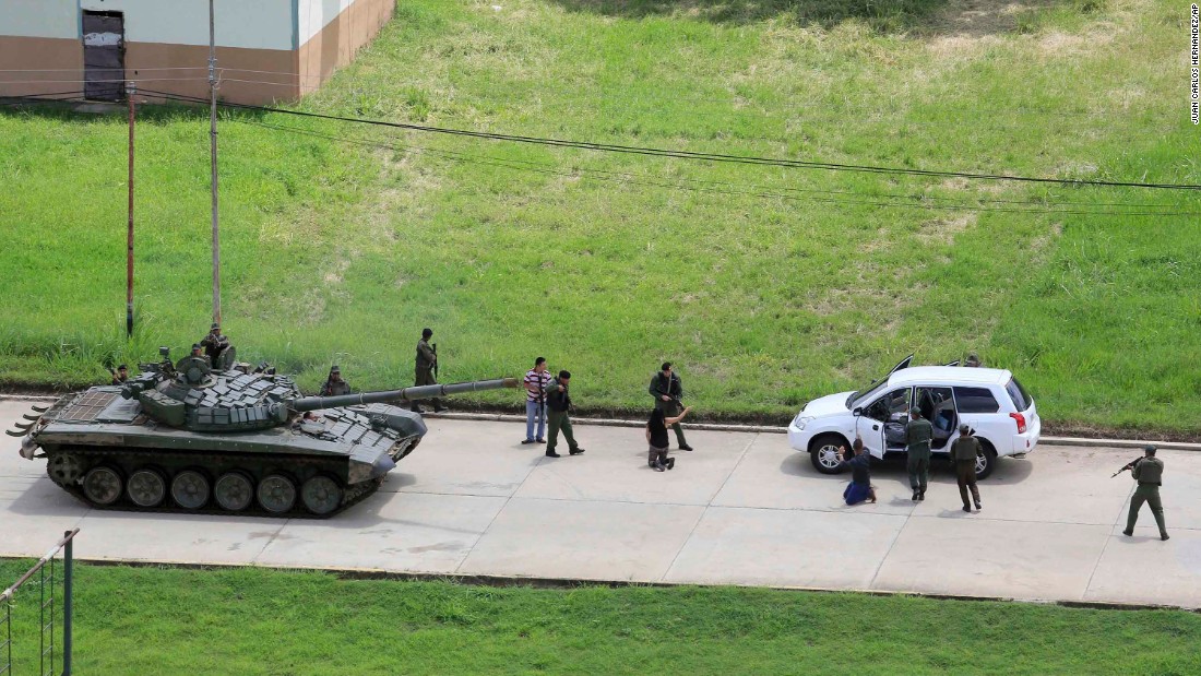 Soldiers stop a vehicle and detain its passengers on the Paramacay military base in Valencia, Venezuela, on August 6. According to authorities, two people were killed when &lt;a href=&quot;http://us.cnn.com/2017/08/06/americas/venezuela-unrest/index.html&quot; target=&quot;_blank&quot;&gt;an anti-government paramilitary attack was quelled&lt;/a&gt; at the base.