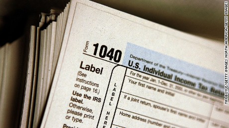 DES PLAINES, IL - MARCH 23: The top of a form 1040 individual income tax return for 2005 is seen atop a stack on the same at the Des Plaines Public Library March 23, 2006 in Des Plaines, Illinois. Americans are preparing for the income tax filing deadline next month whether using tax software, filing on the paper forms or using a tax preparer.  (Photo by Tim Boyle/Getty Images)