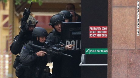 Armed police are seen outside the Lindt Cafe, Martin Place on December 15, 2014 in Sydney, Australia.