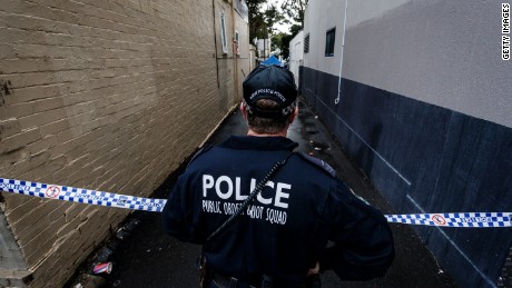 A Police officer watches over an ongoing operation in Surry Hills on July 31, 2017 in Sydney, Australia.