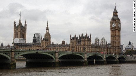 The Houses of Parliament and Elizabeth Tower are seen from across the Thames in October 2015.