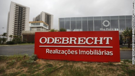 RIO DE JANEIRO, BRAZIL - APRIL 12:  An Odebrecht sign is displayed in front of the now abandoned Rio 2016 Olympic Games athletes village on April 12, 2017 in Rio de Janeiro, Brazil. A plea bargain by Odebrecht employees in the Lava Jato (Car Wash) corruption scandal has led to testimony ensnaring nine ministers in President Michel Temer's cabinet under investigation as the political crisis in the country deepens.  (Photo by Mario Tama/Getty Images)