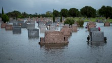 A graveyard is flooded in Pearland, Texas.