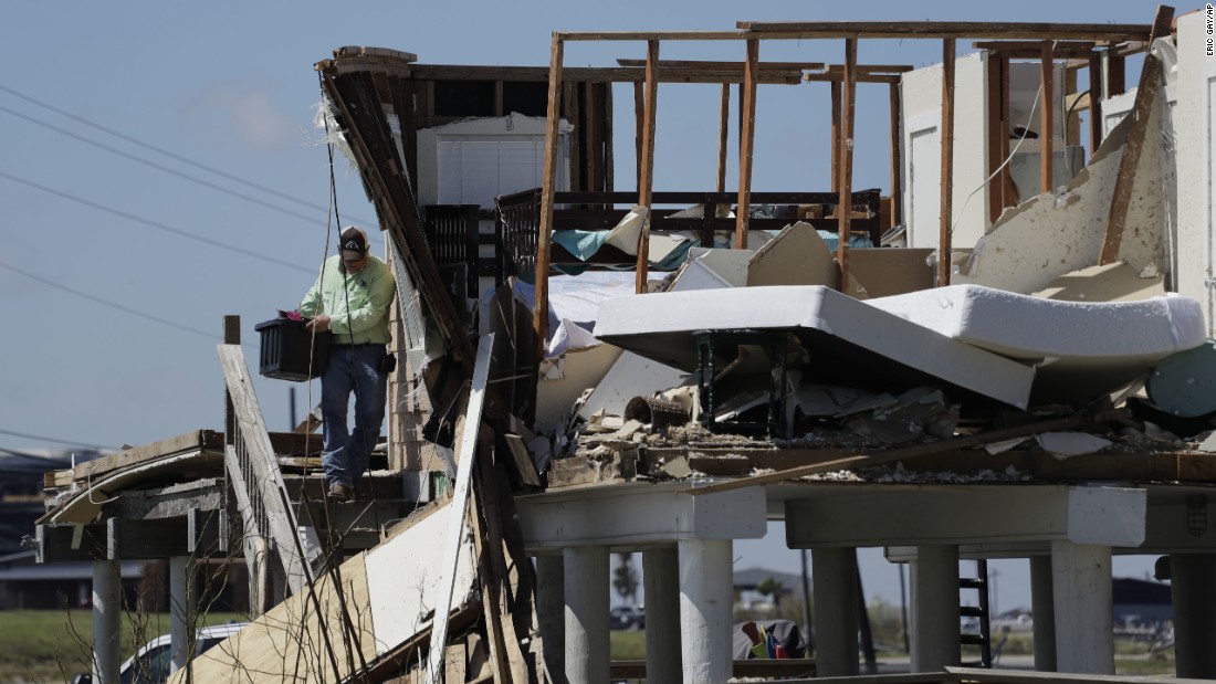 Shane Johnson removes items from a family home in Rockport, Texas, on August 29.