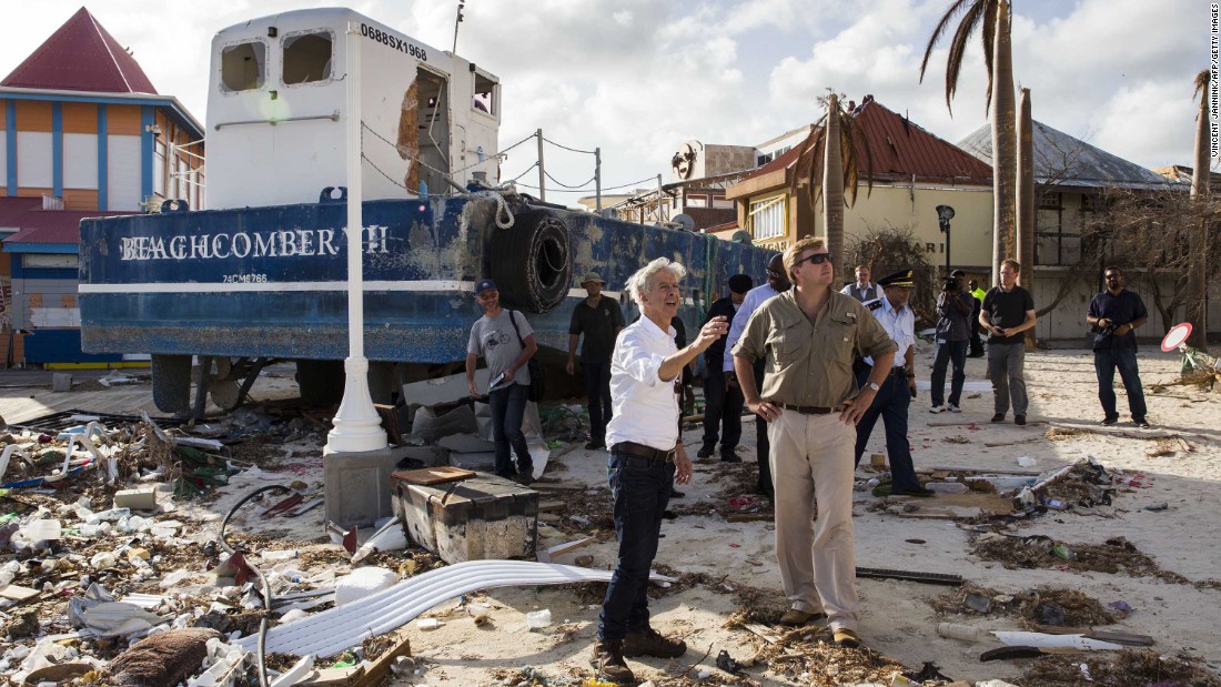 Dutch King Willem-Alexander, front right, tours damage in St. Maarten on September 11. 