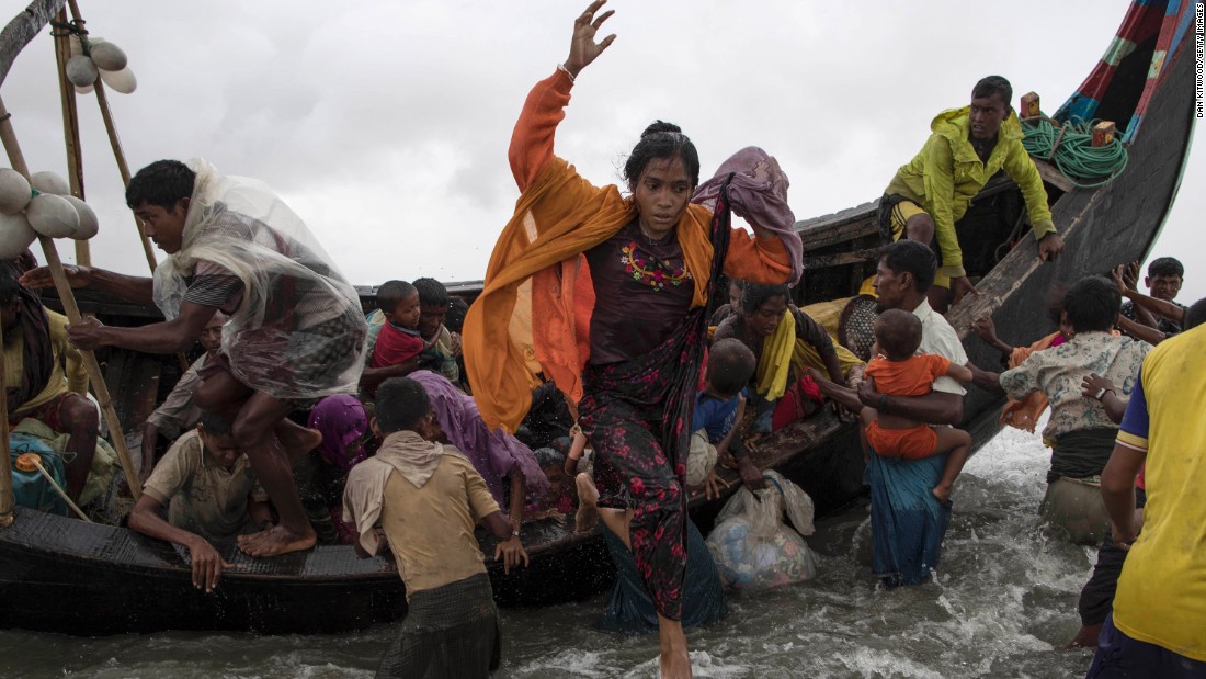 Refugees jump from the boat in Dakhinpara on September 12.