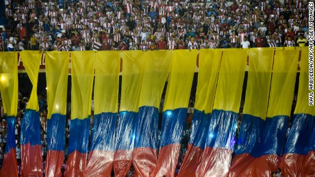 Supporters of Colombia's Atletico Junior cheer for their team before the start of their Copa Sudamericana football match againts Paraguay's Cerro Porteno at Roberto Melendez stadium in Barranquilla, Colombia on September 19, 2017. / AFP PHOTO / RAUL ARBOLEDA        (Photo credit should read RAUL ARBOLEDA/AFP/Getty Images)