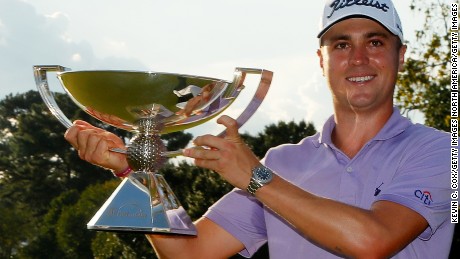 ATLANTA, GA - SEPTEMBER 24:  Justin Thomas of the United States celebrates with the trophy on the 18th green after winning the FedExCup and second in the TOUR Championship during the final round at East Lake Golf Club on September 24, 2017 in Atlanta, Georgia.  (Photo by Kevin C. Cox/Getty Images)