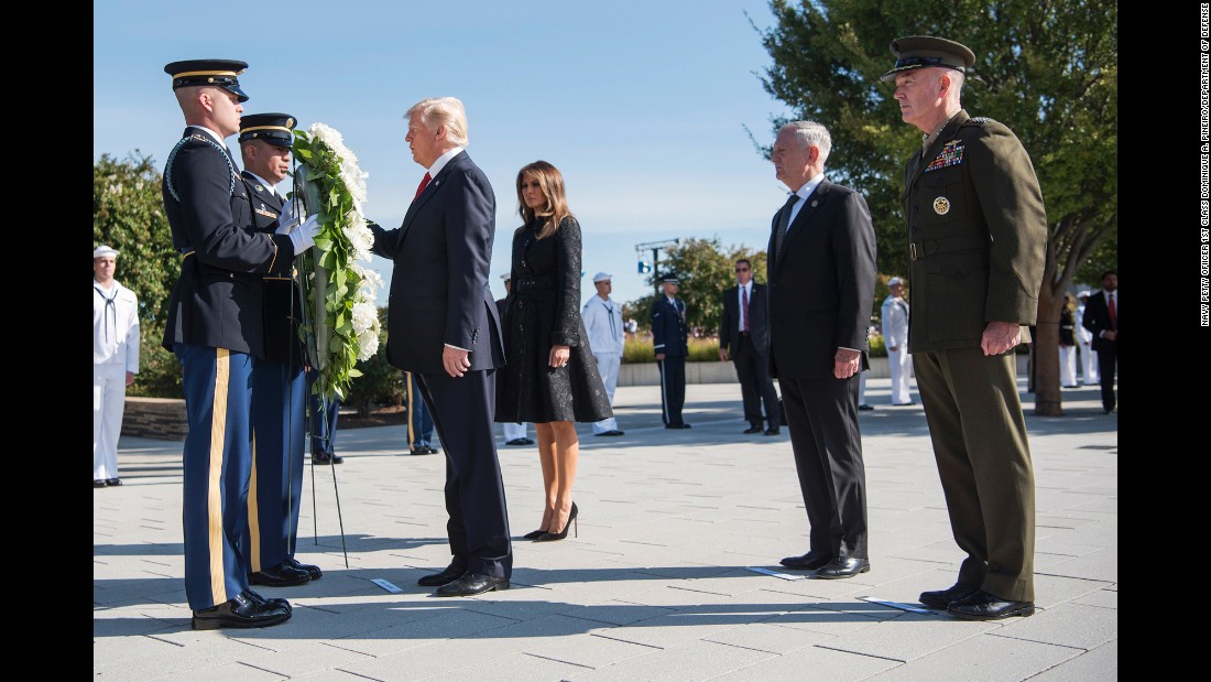 President Donald Trump, accompanied by first lady Melania Trump, participates in a wreath-laying ceremony at the Pentagon, 16 years after the September 11 terrorist attacks.