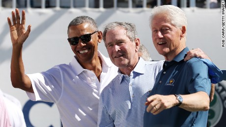 JERSEY CITY, NJ - SEPTEMBER 28:  (L-R) Former U.S. Presidents Barack Obama, George W. Bush and Bill Clinton attend the trophy presentation prior to Thursday foursome matches of the Presidents Cup at Liberty National Golf Club on September 28, 2017 in Jersey City, New Jersey.  (Photo by Rob Carr/Getty Images)