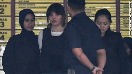 Royal Malaysian Police escort Vietnamese defendant Doan Thi Huong (2nd L) after her trial at the Shah Alam High Court in Shah Alam, outside Kuala Lumpur on October 2, 2017, for her alleged role in the assassination of Kim Jong-Nam, the half-brother of North Korean leader Kim Jong-Un.
Two women pleaded not guilty on October 2 to murdering the half-brother of North Korea&#39;s leader at the start of their trial in Malaysia, as prosecutors alleged they practised for the Cold War-style assassination before carrying it out. / AFP PHOTO / MOHD RASFAN        (Photo credit should read MOHD RASFAN/AFP/Getty Images)