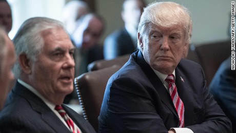 US President Donald Trump listens to Secretary of State Rex Tillerson speak during a cabinet meeting at the White House in Washington, DC, on June 12, 2017. 