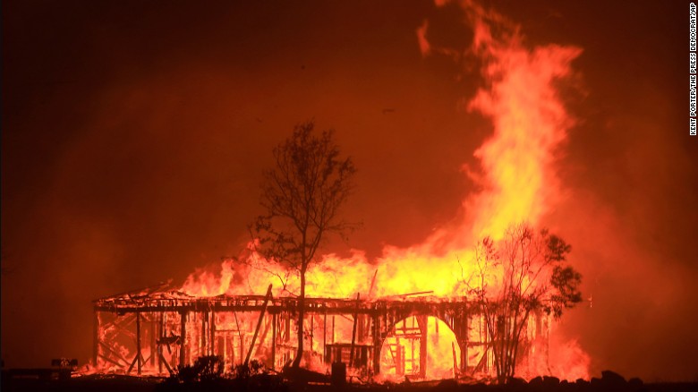 A historic barn burns in Santa Rosa on October 9.