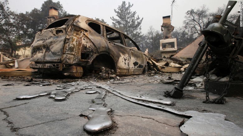 Puddles of melted metal trail away from a burned-out car near Napa on October 10. 