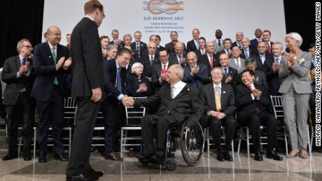 Finance Ministers and central bank governors greet Wolfgang Schaeuble (C), Germany's finance minister, as he arrives for the  the G20 Finance ministers group photo at the IMF  headquarters  in Washington, DC on October 12, 2017. / AFP PHOTO / ANDREW CABALLERO-REYNOLDS        (Photo credit should read ANDREW CABALLERO-REYNOLDS/AFP/Getty Images)