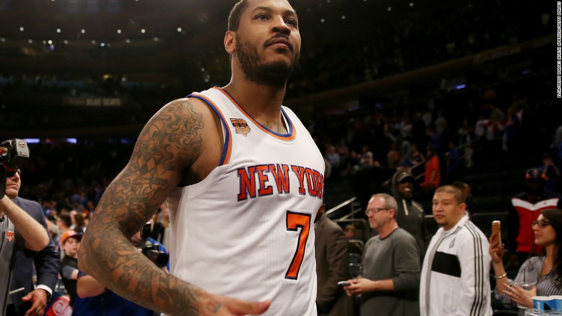 NBA star Carmelo Anthony is one of many athletes who sports a sleeve -- a series of tattoos covering his arm. On his right arm is a flaming basketball with his initials, representing his commitment to his sport. 